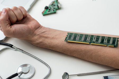 cropped view of male hand with microchip and syringe for microchipping on tableの写真素材