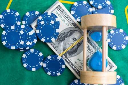 Poker chips and banknotes on table in casino