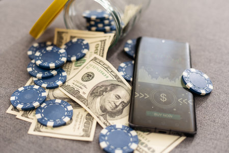 This eye catching image of two miniature businessmen shaking hands could be used for the stock market, banking, real estate and wealth management. The blue chips represent a solid investment.の写真素材