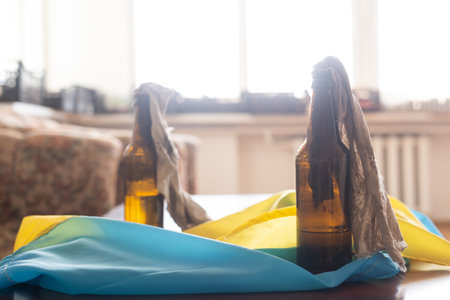 Ukraine flag colors yellow-blue with a molotov cocktail. Stop war between Russia and Ukraine. power of Ukraineの写真素材