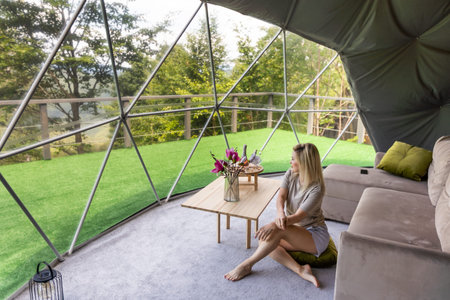 female tourist in transparent hotel dome