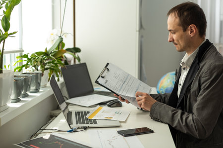 Successful business man, company boss, stock investor, conducts financial brainstorm with group of multiracial partners by video call, discuss investments in the stock market. Online video conferenceの写真素材