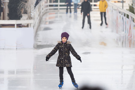 teenage girl skating outdoor, ice rink
