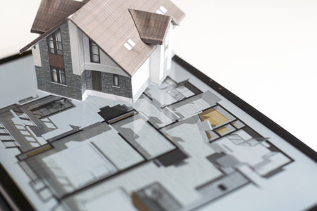 Small house model is on screen tablet and icons home electronics devices connecting with wireless. Smart home controlled and Automation system technology of things.の写真素材