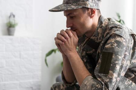 Portrait of middle aged sad, desperate military man during therapy session. Disabled soldier suffering from depression psychological trauma. PTSD concept.の写真素材