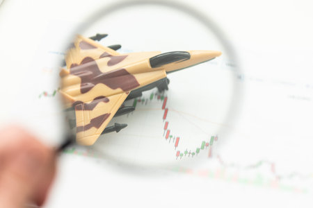 Review airlines company service and tickets price concept. Airplane model under magnifying glass on grey background.の写真素材