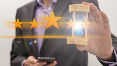 The persons hand pointing at hovering stars. Rating, evaluation.
