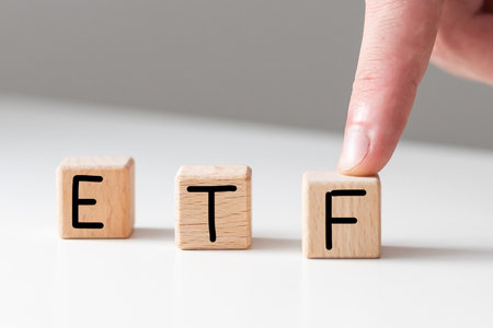 Text ETF on wooden cubes on white textured putty background. Abbreviation of Exchange Traded Funds. Square wood blocks. Top view, flat lay.の写真素材