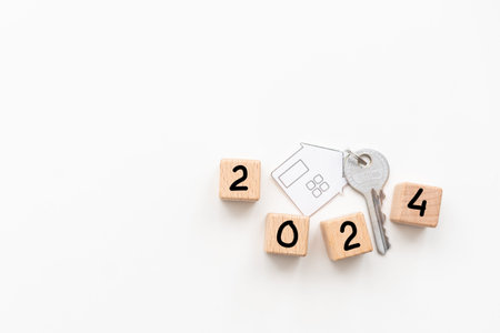 Wooden 2023 to 2024 new year white background. Word 2022 - 2023 wood cube on wooden desk for copy...
