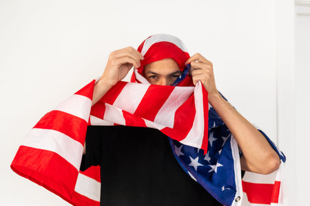 An Arab man wrapped in an American flag