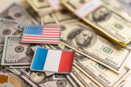 us and france flags with euro and dollar banknotes mixed imageの写真素材