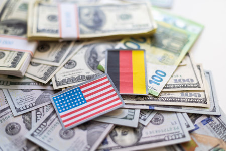 close up of one hundred dollars banknotes on USA flagの写真素材