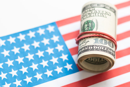 U.S. 100 dollar banknote on american flag background for design purpose