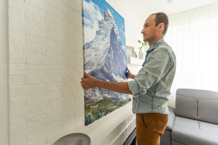 Waist up portrait of modern bearded man buying picture in art gallery, copy space