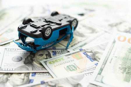 toy, car had accident on dollar banknotes.insurance concept