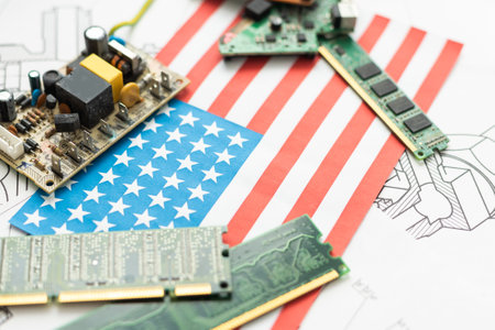 Flag of USA on a processor, CPU Central processing Unit or GPU microchip on a motherboard. US firms have become the latest collateral damage in US-China tech war. US blocks sales of AI chips to China.の写真素材