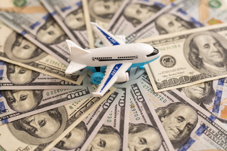 white plane on dollar cash closeupの写真素材