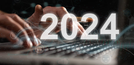 Hand touching global network and data customer connection with the 2024 year on dark blue...