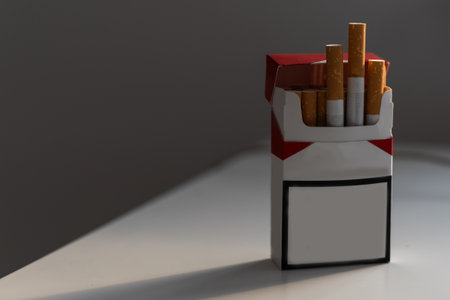 Smoking concept. Blank no name cigarettes packets isolated on black background, space for text. 3d illustrationの写真素材