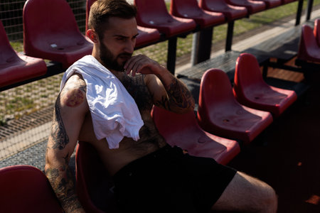 Young sportsman take a break after training. Fitness, sport and lifestyle conceptの写真素材