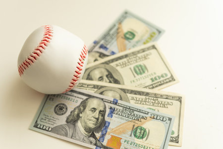 Closeup concept of baseball and money.の写真素材