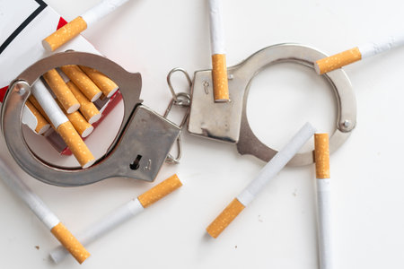 Stop smoking concept. Cigarettes in handcuffs.の写真素材
