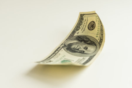 One hundred dollars banknotes isolated on white backgroundの写真素材