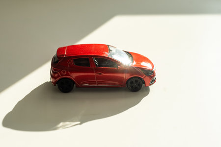 Red toy car on a white background.の写真素材