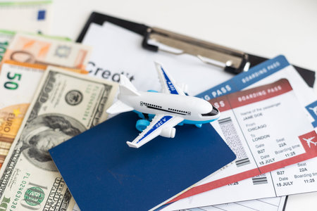 Preparation for Traveling concept, toy airplane, passport with copy spaceの写真素材