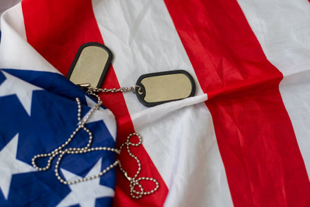 American flag and soldiers tags on background. Veterans Day Concept.の写真素材