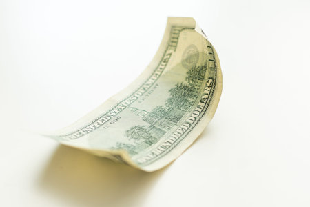 100 dollar bill on white background