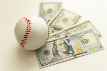 Baseball with cash money. Major league strike, lockout and sports betting concept.の写真素材