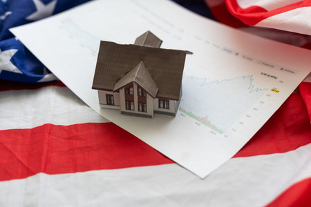 Immigration in the United States. Miniature house on the American flag. To leave for permanent residence in America. Relocation to the States. Accommodation in America. Emigration.の写真素材