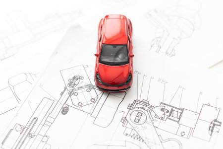 Thailand, April 5, 2018 : Cheque book , pen and red Volk swaken mini car model isolated on white background. Buy car by cheque payment in concept.の写真素材