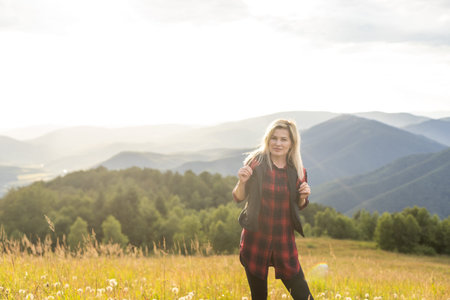 woman backpacker enjoy the view at mountain