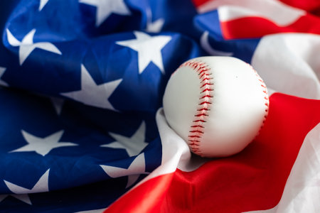 Baseball ball on American flag background for symbolic July 4th or Memorial day sports concept.の写真素材