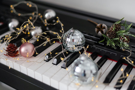 Christmas ball on piano keys. Carol music conceptの写真素材