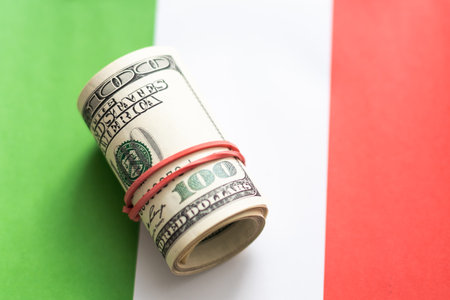 Italy flag on US America dollar banknotes money, finance concept.の写真素材