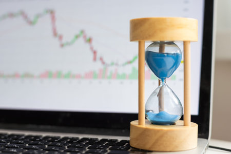 Time is money, make money and time management business and technology concept, hourglass on laptop...