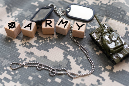 Military ID tags and patches on camouflage backgroundの写真素材