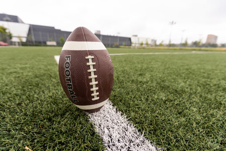 Football on Yardage Marker. Low Angle. Horizontal Viewの写真素材