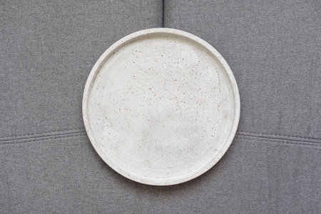 Background for a culinary or restaurant theme. Gray flat plate with small sidesの写真素材
