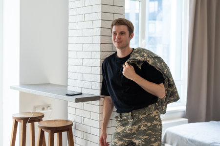 military man in new apartmentsの写真素材