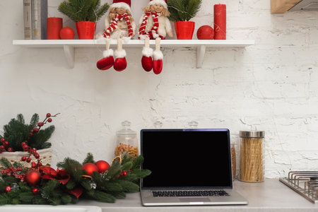 desk with computer with against christmas backgroundの写真素材