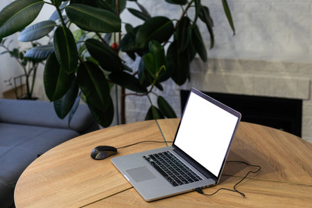 Mock up digital tablet with wireless keyboard on wooden table.
