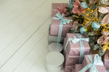 Many beautiful gift boxes under Christmas treeの写真素材