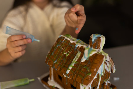 Young girl making gingerbread cookies at home.の写真素材