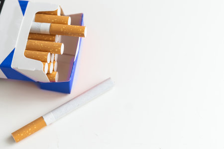 Pack full of filtered cigarettes on white isolated background.の写真素材