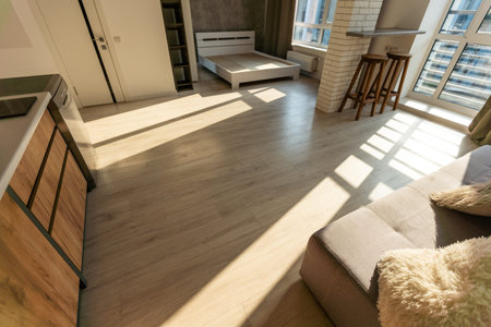 Modern room, home office interior. Room with sofa, desk, chair, small table and other furniture.