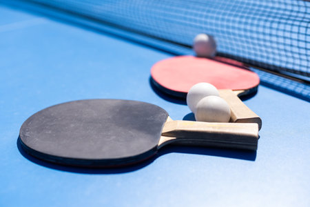 sports composition. Ping pong close-up. rackets for playing on a blue background.